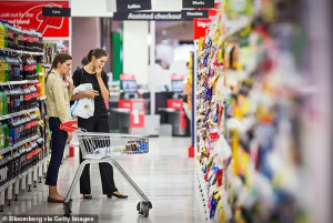 Australians have been warning the cost of living crisis is far from over ahead of another inflation hike (pictured, shoppers in a Sydney Coles)
