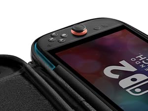 Close-up view of a gaming device with black case and control buttons visible against dark background.