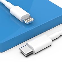White electrical adapter with folding prongs and multiple ports, designed for international travel. Features two USB ports and accommodates various plug types.