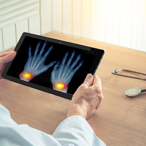 Person using a stylus on a tablet computer displaying colorful artwork, suggesting digital illustration or graphic design.