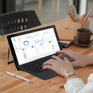 a laptop with a laptop on the screen and a desk on the side.