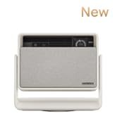 White square-shaped device with a handle and digital display. Appears to be a compact electronic appliance, possibly for home use.