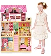 a toy house with a christmas tree in the background