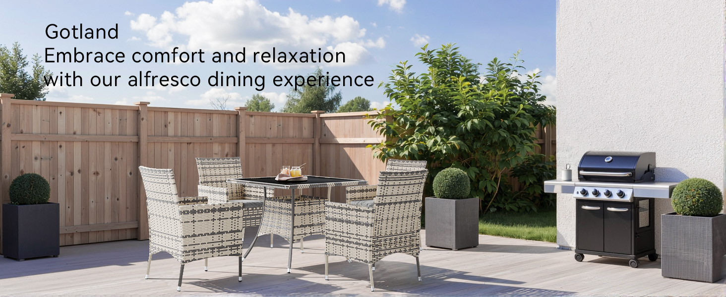 Text reads 'Godsend' and 'Embrace comfort and relaxation with our alfresco dining experience'. Outdoor patio area with wooden privacy fence, modern grey furniture, and built-in grill station.