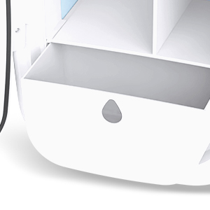 Close-up detail view of white product with black trim showing ventilation slots or grille pattern.