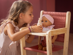 Series of images showing stretching or exercise movements performed on the floor in an indoor setting with wooden flooring.
