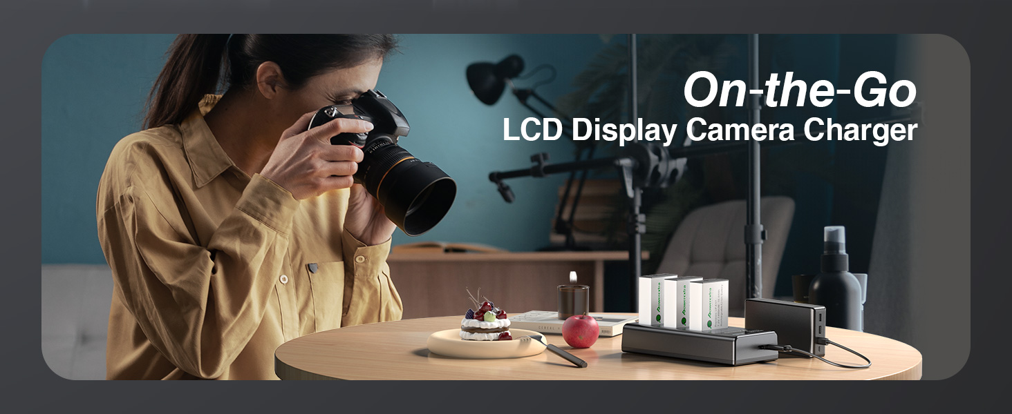 Text reads 'On-the-Go' and 'LCD Display Camera Charger'. Dark-toned product photography showing camera charging device with digital display.