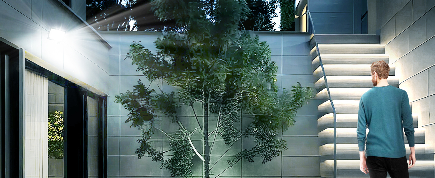 Exterior lighting illuminating a modern walkway with vertical slatted walls and potted tree, creating dramatic evening ambiance.