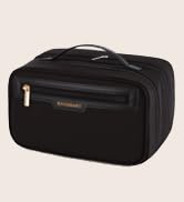 Small cream-colored clutch or wallet with zipper closure and wrist strap handle, photographed against white background.