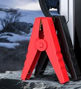 Close-up of a digital display screen showing numerical readings against a dark blue background with mountains