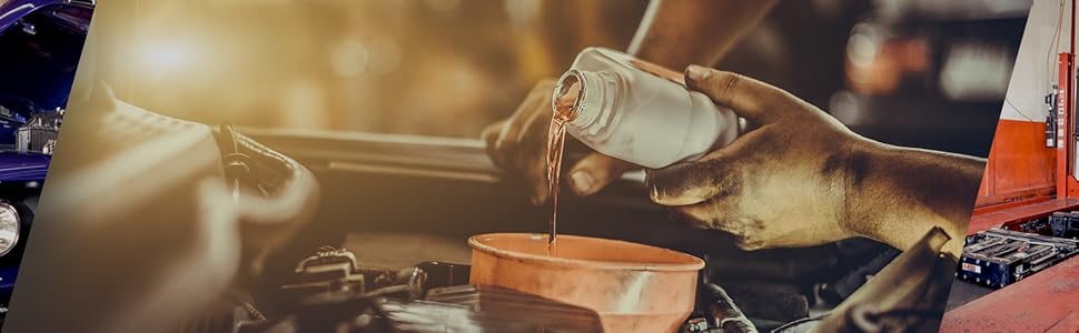 Evening or night scene showing vehicles and outdoor lighting, appears to be a transportation or logistics setting.