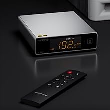 Digital device with LED display showing '12:22' in orange numerals against dark background, includes remote control in multiple viewing angles.