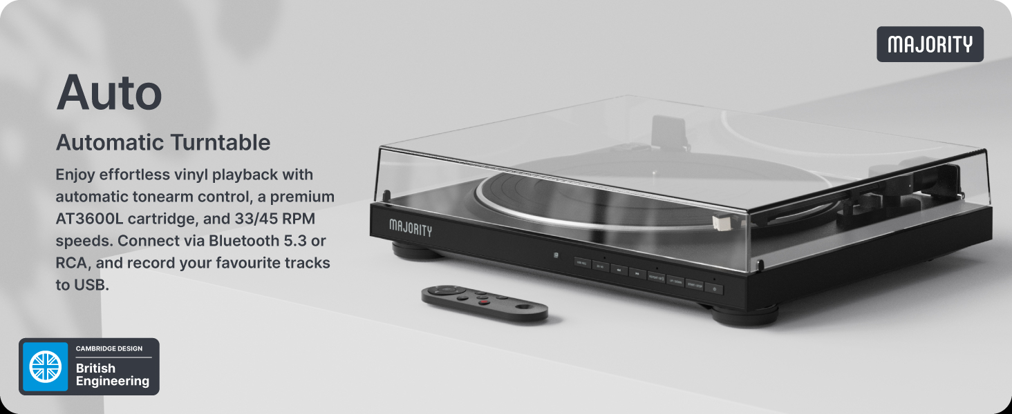 Text reads 'Auto' and 'Automatic Turntable'. Modern record player or turntable with sleek black design, featuring control buttons and tonearm. Product shown from multiple angles against white background.