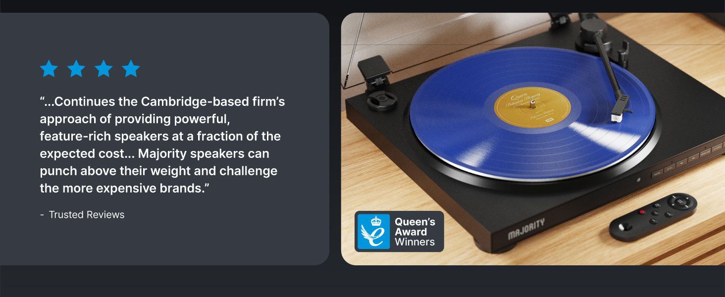 Professional turntable setup with blue vinyl record playing. Four blue stars visible in corner of image. Audio equipment displayed against dark background.
