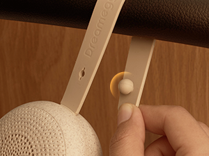 Wooden spoon or spatula shown being cleaned with soap and water in kitchen sink. Close-up view of washing process.