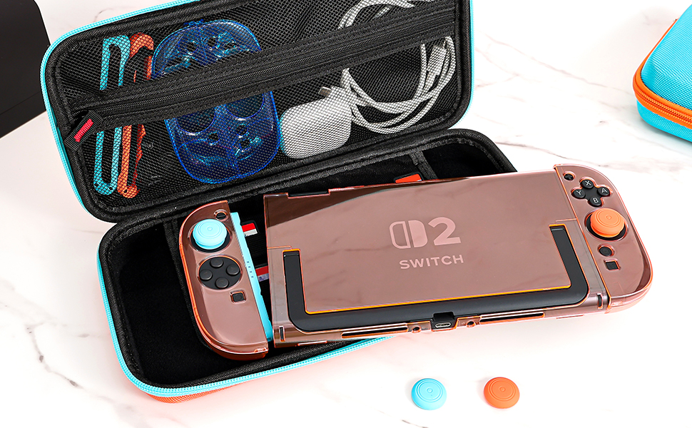 Text reads 'Image 2'. Bright turquoise protective carrying case with gaming accessories including controllers and what appears to be a portable screen or device.