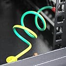 Multiple views of a black server rack or network cabinet with ventilation slots, showing different angles of the enclosure design.