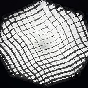 Multiple views of white, circular, cotton-like material or padding shown from different angles on dark background.