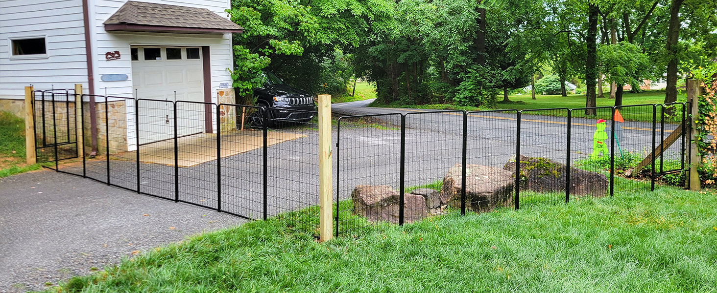 Series of outdoor images showing black metal fencing installation along a gravel driveway and grassy yard area.