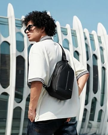 Text reads 'Image 1'. Gray duffel bag with black trim featuring top handles, adjustable shoulder strap, and multiple compartments secured with zippers.