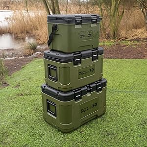 Sequence showing olive green heavy-duty storage cases or containers stacked on grass, with reinforced corners and industrial-style design.
