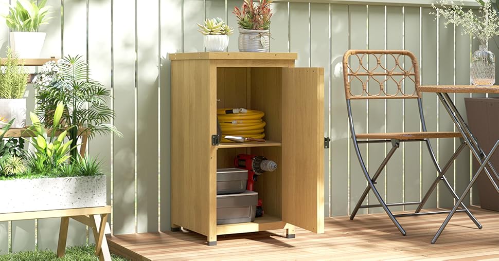 Wooden storage cabinet with shelving shown in outdoor patio setting, positioned against wall with folding furniture nearby.