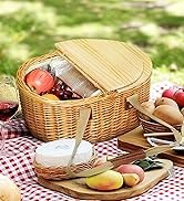 Person sitting inside yellow tent, looking out at sunrise or sunset. Sleeping pad visible on tent floor.