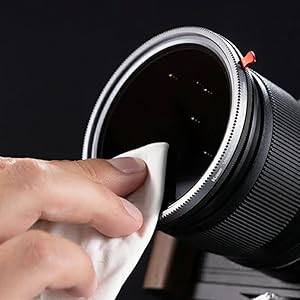 Close-up images showing hands adjusting camera lens components, demonstrating lens maintenance or assembly process.