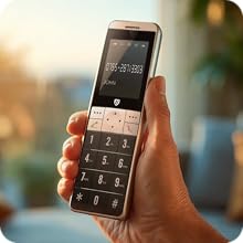 Silver and black cordless telephone with numeric keypad displayed on black charging dock. Phone shows display screen with time reading, positioned on wooden surface in home setting.