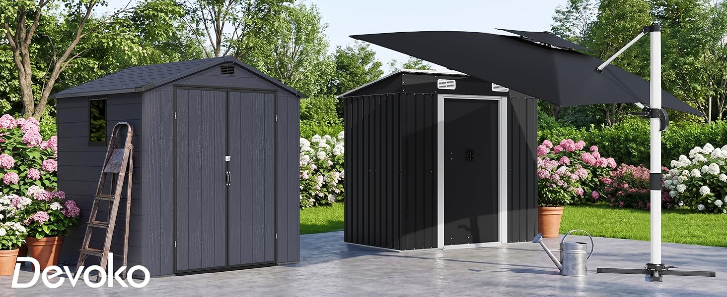 Text reads "Deweko". Two black modular garden storage boxes positioned outdoors with green landscaping and trees in background.