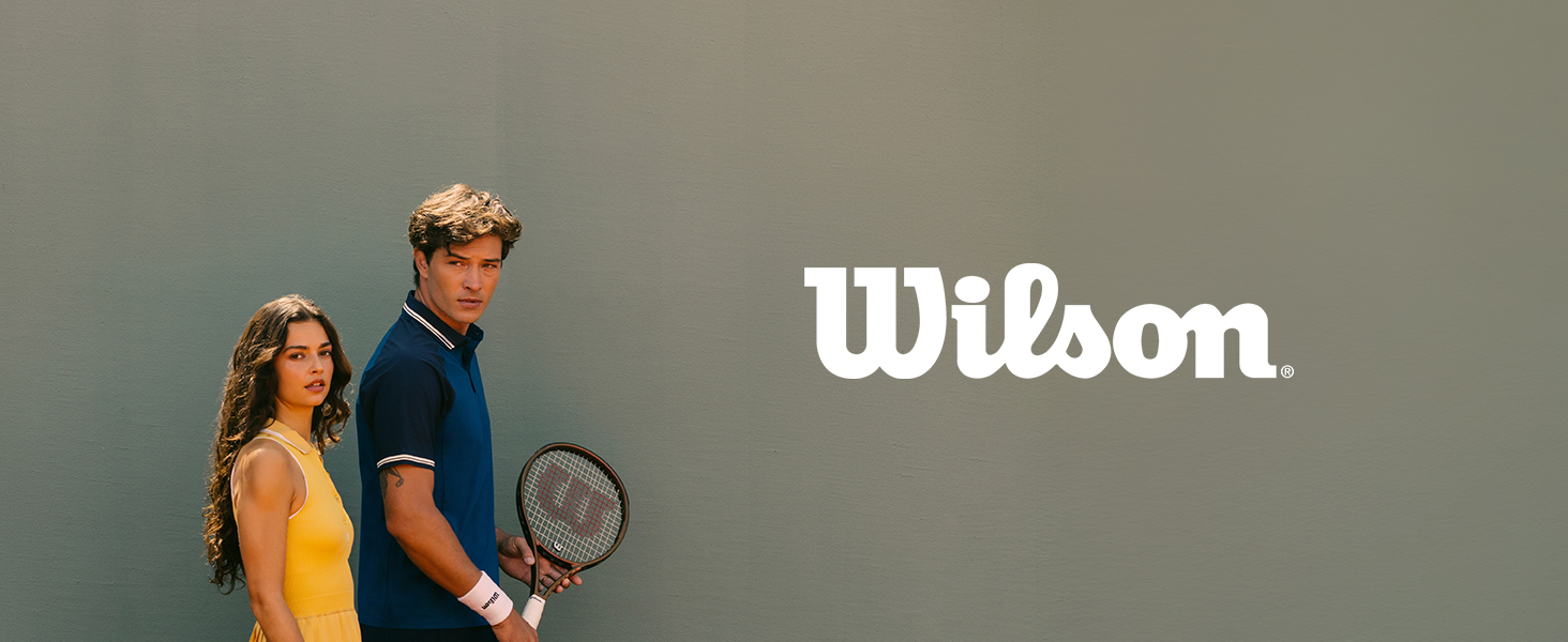 Text reads 'Wilson' in white lettering. Two people wearing athletic casual clothing posing with tennis racket against gray background.