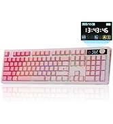 Text reads '18:01:06'. White and blue mechanical keyboard with blue keycaps, number pad, function keys. Digital display shows time above keyboard on dark background.