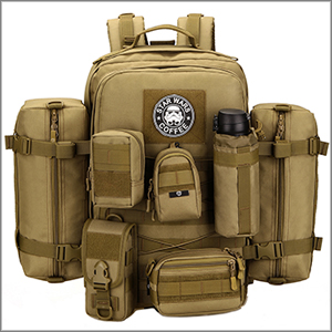 Olive-green canvas backpack with front quilted X-pattern design and brown shoulder straps, displayed flat against neutral background showing organizational compartments.