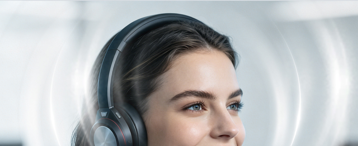 Woman wearing black over-ear wireless headphones with microphone boom, photographed in profile against blurred architectural background.