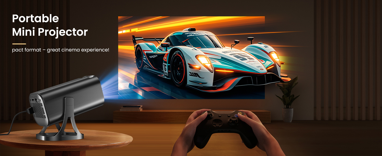 Text reads 'Portable Mini Projector'. Image shows gaming setup with projected race car game display and game controller in dark setting.