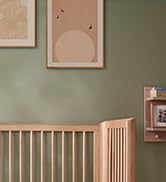 Bamboo wall-mounted storage cabinet with slatted door design shown in natural wood finish against white wall. Features vertical slat pattern and compact rectangular shape.