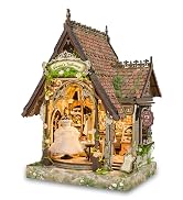 Text reads 'Heartfelt Caf&eacute;'. Miniature wooden dollhouse-style caf&eacute; structure with illuminated interior, featuring furniture, decorative plants, and warm lighting details.