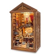 Light blue decorative box with hinged doors opening to reveal an ornate miniature room interior featuring golden lighting, furniture, and detailed architectural elements.