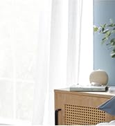 Text reads: 'protectors' and 'Keep your bedding fresh with our durable protectors that extend the life of your mattress and pillows.' Clean white bedding and pillows on a made bed.