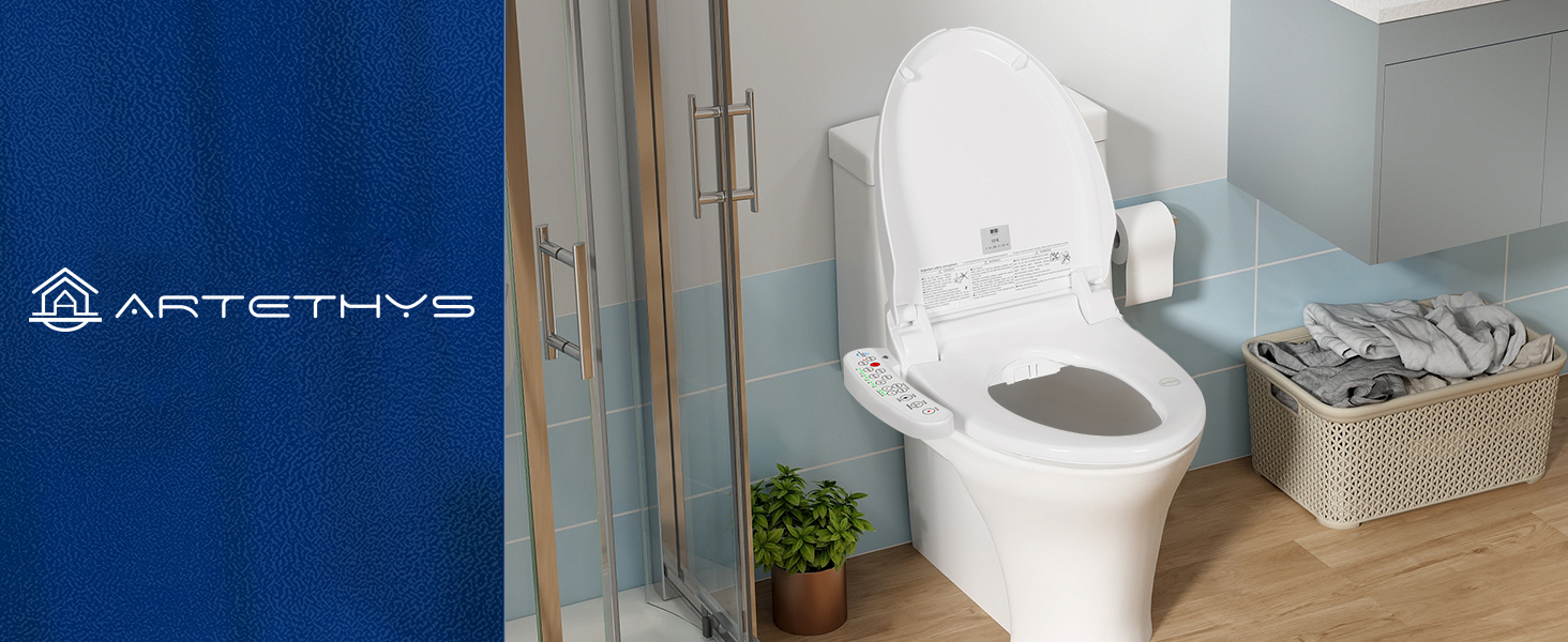 White toilet with elongated bowl and tank in modern bathroom. Wicker basket visible nearby. Blue logo or text in bottom left corner.