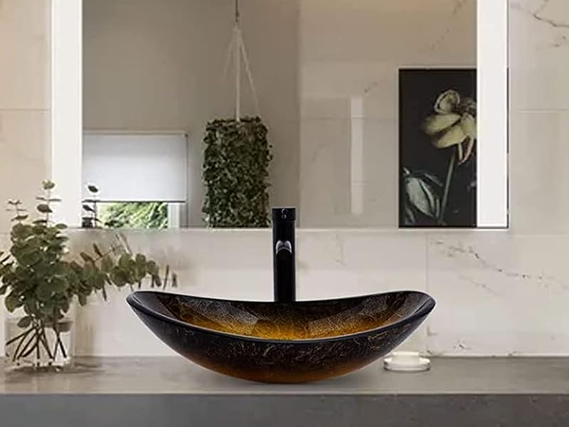 Modern bathroom vanity with illuminated mirror, vessel sink, and floating shelves. Marble-like wall finish and plants add elegance to the space.