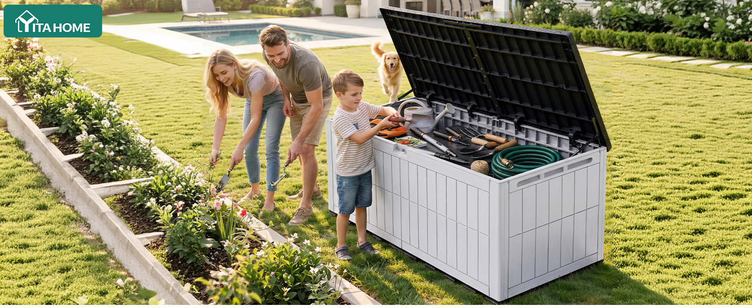 Three children outdoors near white storage box with open black lid in grassy field setting. Appears to be outdoor storage or garden equipment demonstration.