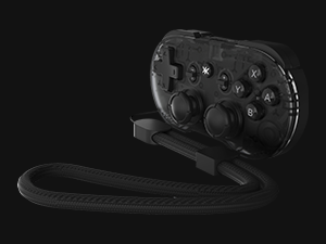 Dark handheld gaming controller with multiple buttons and directional pad on black background.