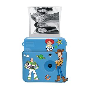 Text reads "Lexibook" on blue children's educational tablet device with colorful game icons on screen, green control buttons, alien and planet graphics on casing.